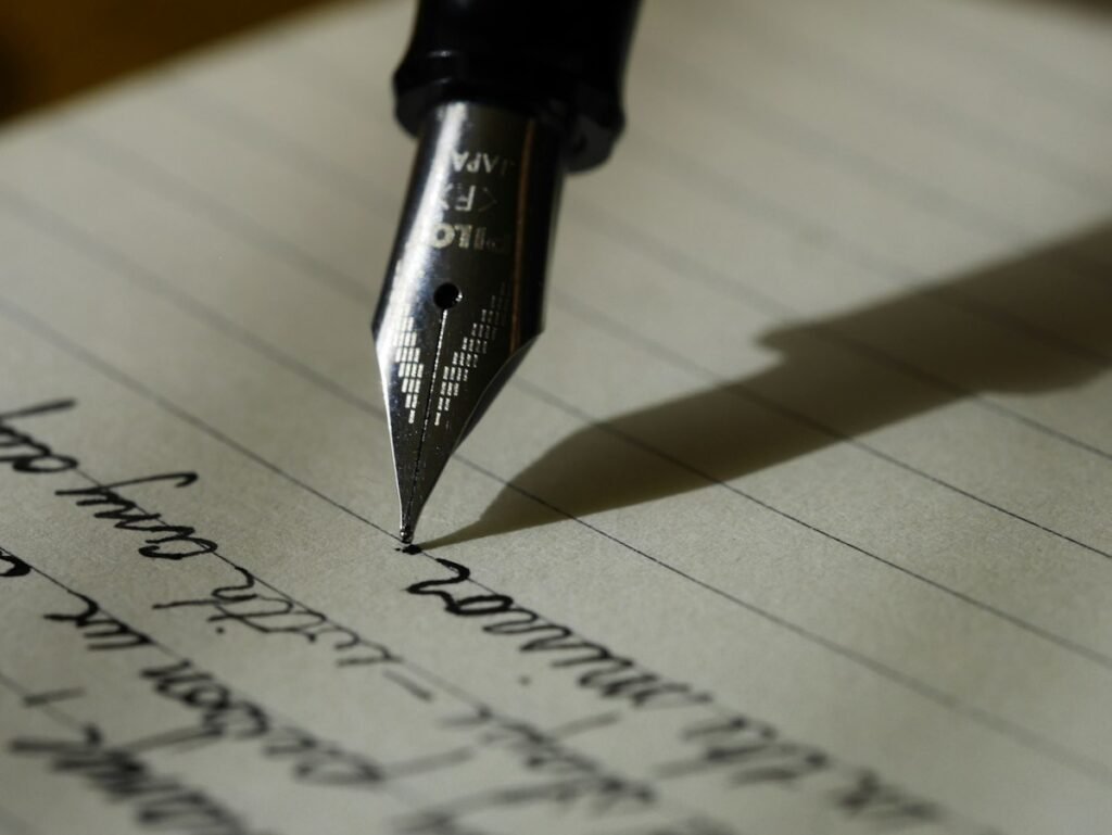 Notebook and pen on a desk representing writing services